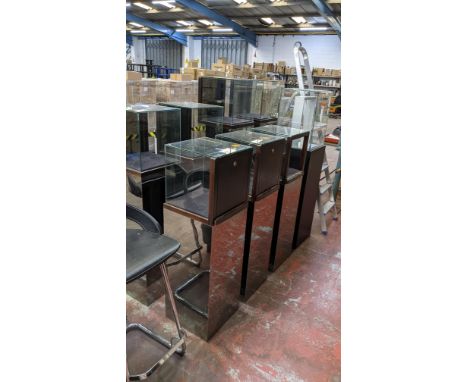 8 off assorted display cabinets. We have one key which opens 7 of the cabinets. The 8th cabinet is open but has no key. The c