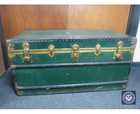 An early 20th century metal bound travelling trunk