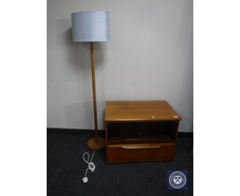 A teak glass door entertainment stand together with a teak standard lamp with shade