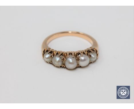 A Victorian five-pearl ring, size M