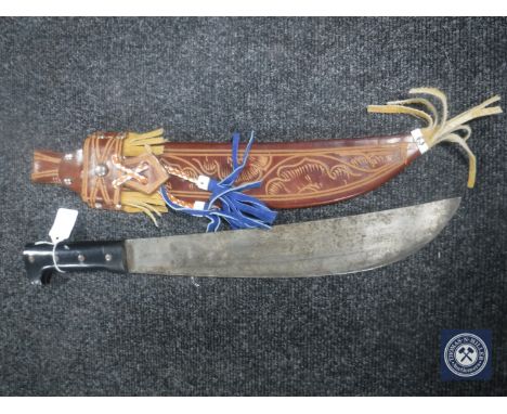 A machete in leather sheath