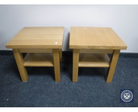 A pair of contemporary oak two-tier lamp tables