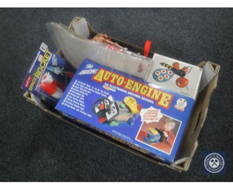 A box containing assorted toys including a boxed vintage engine, Captain Scarlet die cast figures, Thunderbirds etc