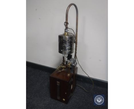A mahogany cased volt meter converted into and industrial style lamp