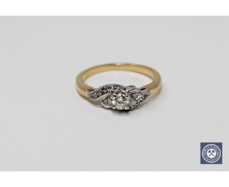 An 18ct gold diamond set ring, size M