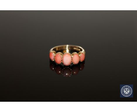 A 9ct gold coral ring, size N1/2