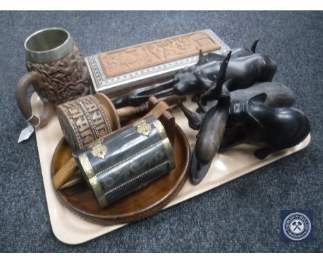 A tray containing carved wooden animal ornaments, wooden trinket box, nutcracker, wooden tankard etc 