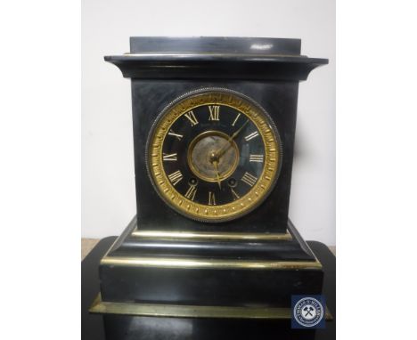 A Victorian black slate and brass mantel clock