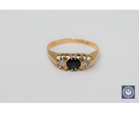 An 18ct gold sapphire and diamond ring, size O