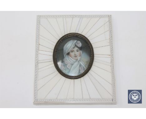 A portrait miniature depicting a lady wearing a head scarf , width 8.9 cm.