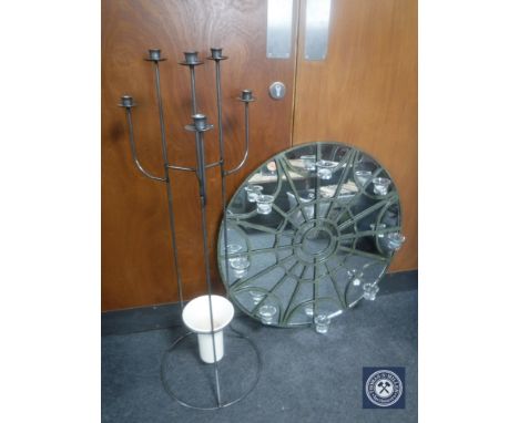 A metal six way candelabra with vase together with a metal framed mirror with eight glass tea light holders 