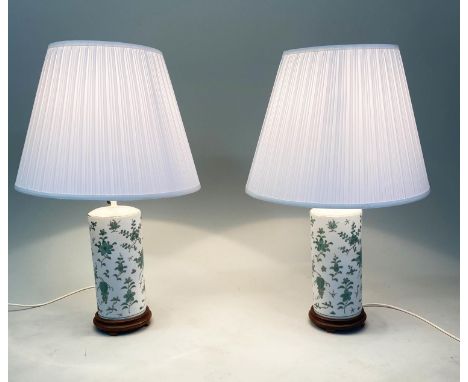 TABLE LAMPS, a pair, Chinese ceramic jade green foliate and gilded cylindrical with carved wood bases (with shades), 70cm H. 