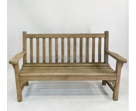 LISTER GARDEN BENCH, weathered teak of substantial slatted construction with flat top arms labelled 'R. A. Lister &amp; Co'. 