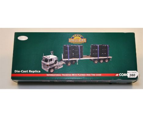 CORGI 1:50 SCALE HEAVY HAULERS INTERNATIONAL TRANSTAR WITH FLATBED AND TIRE LOAD WITH BOX (NMC)