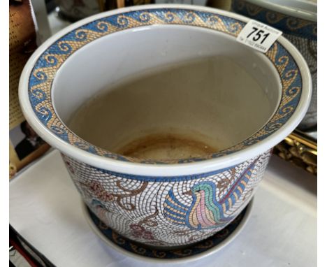 A planter on stand with a Roman mosaic decorated surface