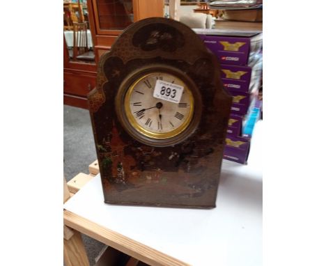A vintage oriental lacquered tin mantle clock