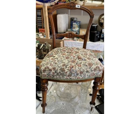 An Edwardian carved mahogany chair with tapestry top