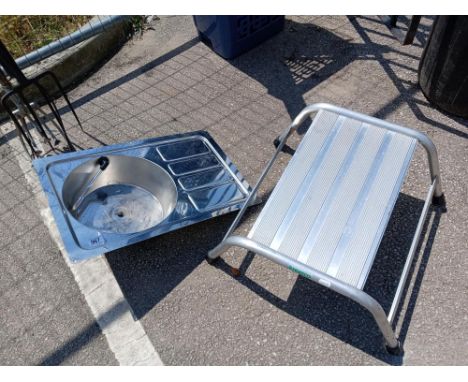 A stainless steel caravan sink &amp; a step