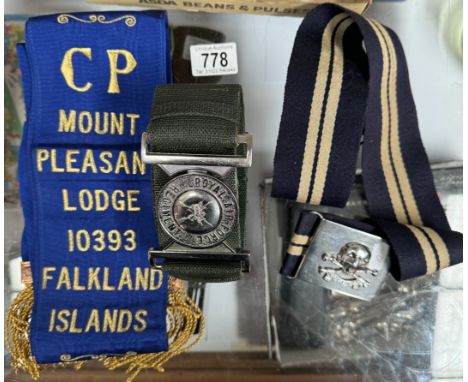 A box of militaria including RAF regiment belt, Masonic Lodge sash, Mount Pleasant (Falkland Islands) etc.