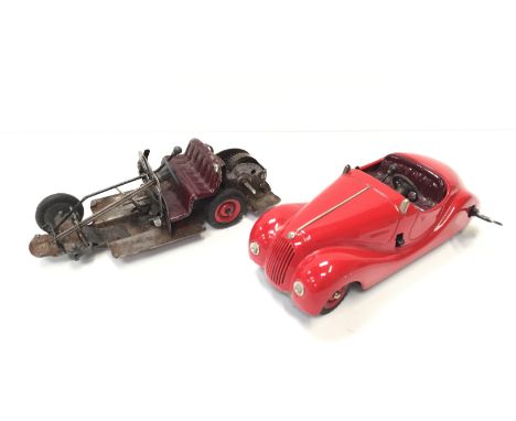Schuco Examico 4001 tinplate clockwork car in red with maroon seats, tinprinted dashboard, gear selector and handbrake, lengt