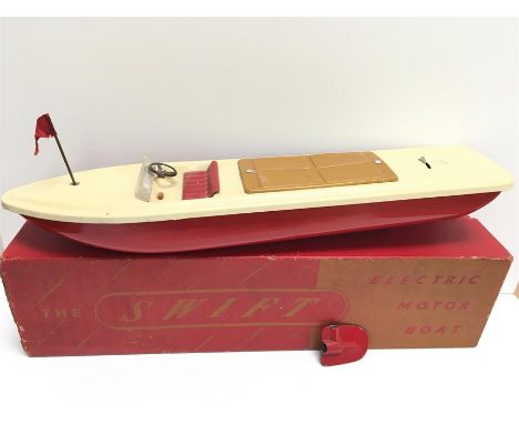 HF Product 'Swift' Electric Motor Boat: battery operated tinplate model with red hull, cream deck, windscreen, steering wheel
