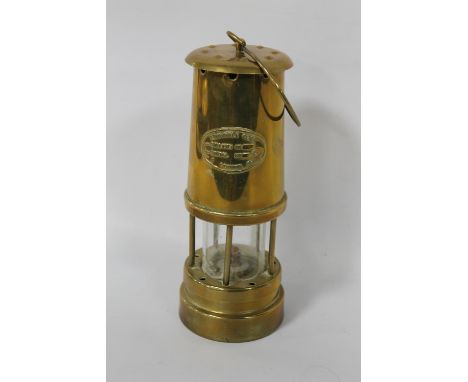A BRASS MINERS SAFETY LAMP, marked Ferdale Coal & Mining Co.