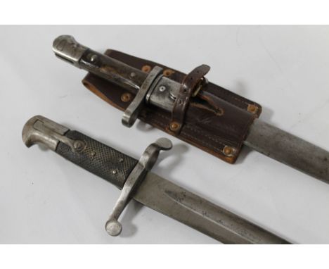 AN 1856 PATTERN BRITISH SWORD BAYONET, with black chequered grip (no scabbard), along with a British WWI bayonet in scabbard 