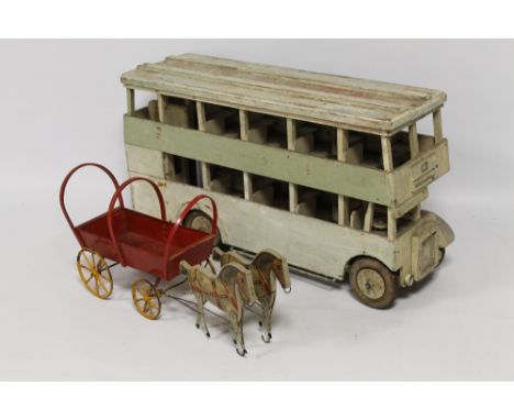 A LARGE SCALE SCRATCH BUILT WOODEN MODEL OF A LONDON BUS together with a wood and metal covered wagon pulled by two horses wi