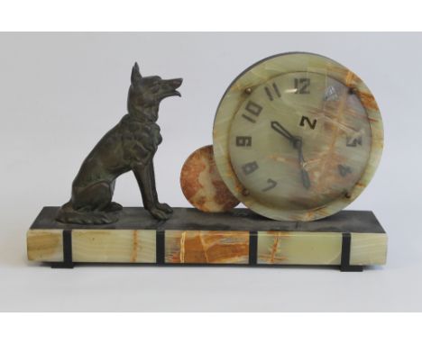AN ART DECO STYLE MARBLE / METAL MANTEL CLOCK, circular dial with Arabic numerals and seated spelter figure of an alsation do