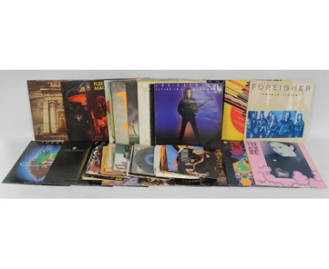 A COLLECTION OF ASSORTED RECORDS, LP'S AND SINGLES, to include Bruce Springsteen, Fleetwood Mac, Meatloaf, Deep Purple, Slade