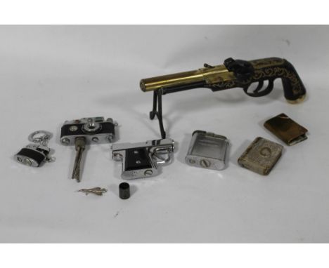 A COLLECTION OF CIGARETTE LIGHTERS to include one in the form of a camera on tripod