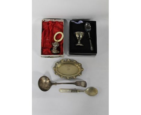 A BOXED CHILD'S BABY RATTLE, together with a teething ring and other sundry plated  items