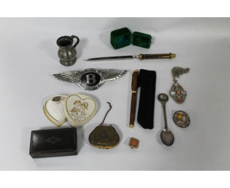 A SMALL TRAY OF COLLECTABLES, to include a Bentley car badge, snuff box etc