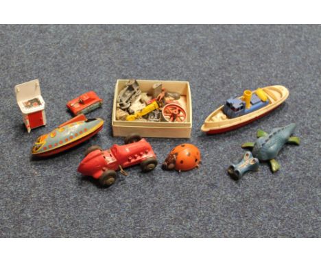 A COLLECTION OF VINTAGE TOYS to include Triang Minic 'Jabberwock', 'Ladybird', a tinplate clockwork 'Planet Special' Spaceshi