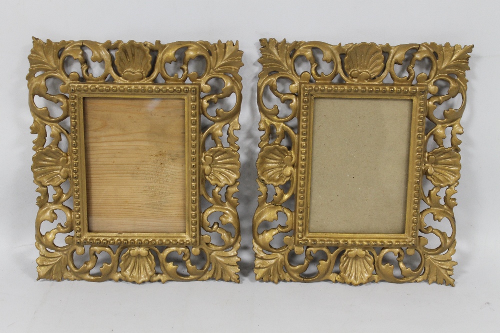 A PAIR OF SMALL DECORATIVE GILT PICTURE FRAMES A/F, 25 cm X 21 cm frame ...