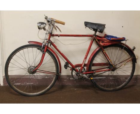 A VINTAGE TRIUMPH BIKE, with front Dyno-hub and 3-speed Sturmey Archer rear hub gears, rod brakes, a Wrights sprung saddle an