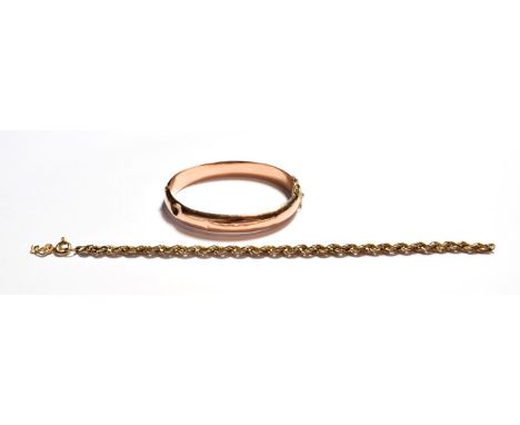 A 9 carat gold hinged bangle (a.f.); and a 9 carat gold ropetwist bracelet (a.f.).  Gross weight 12.6 grams. 