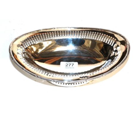 An Edward VII silver basket by T. Wilkinson and Sons, Birmingham, 1907, oval and with pierced sides above a ribbon-tied reede