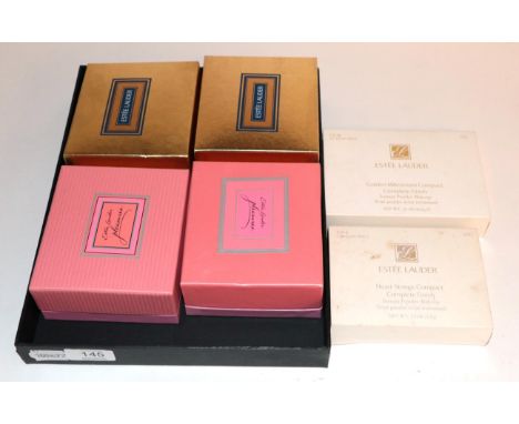 Four assorted Estée Lauder solid perfume compacts, comprising 'Koala Bear'; 'Puppies'; 'Squirrel'; 'Beautiful Pig'; together 