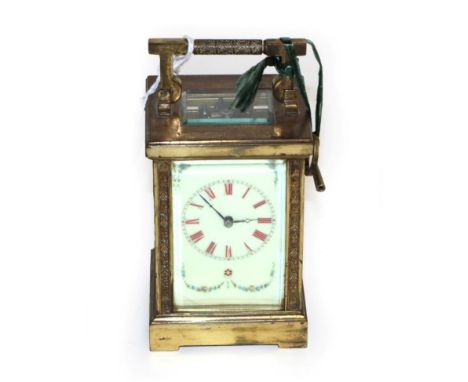 A brass striking carriage clock, circa 1900, enamel dial with Roman numerals and with swag floral decoration