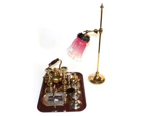 A selection of brass consisting of a pair of candlesticks; teapot; adjustable angle lamp; pair of silver dwarf candlesticks e