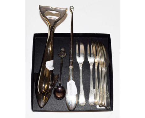 A collection of silver and silver plate, including: a set of six silver cake-forks; a plated bottle opener in the form of a d