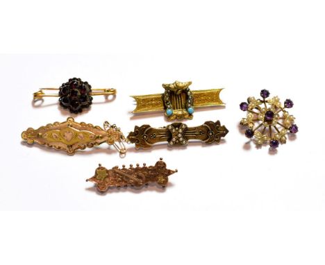 An amethyst and seed pearl brooch/pendant, stamped '9CT'; a 9 carat gold garnet brooch; a turquoise and seed pearl brooch, st