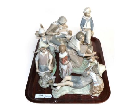 Lladro figure groups and one other (7)
