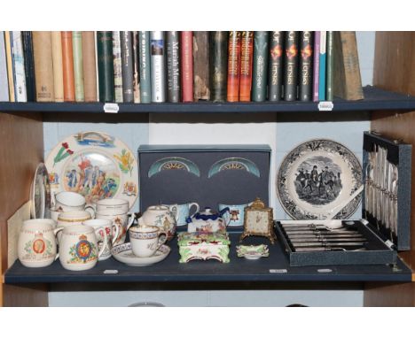 A quantity of mixed ceramics including commemorative wares; silver plated cutlery set; etc (one shelf)