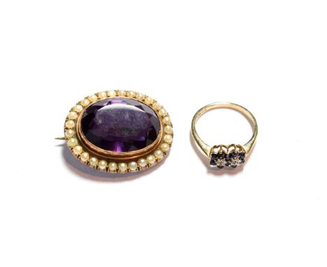 An amethyst and seed pearl brooch, unmarked, length 3.3cm; and a 9 carat gold sapphire and diamond ring, finger size O1/2 .  