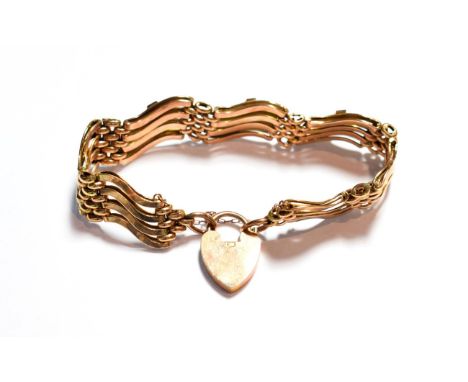 A gemset gate link bracelet, with applied plaque stamped '9C', length 20.5cm (a.f.).  Gross weight 22.5 grams. 