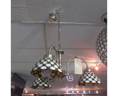 A three branch chandelier with Tiffany style shades together with a bar light 