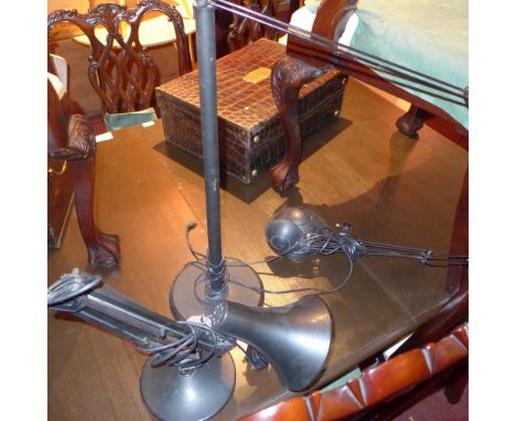 A black adjustable anglepoise lamp together with another two similar 
