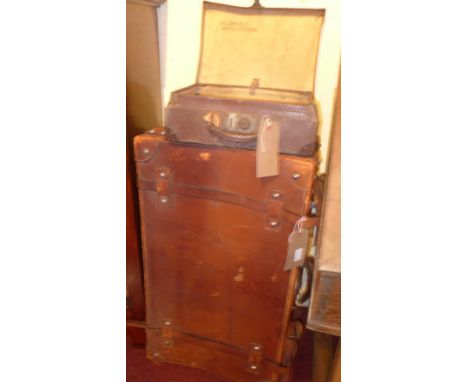 A vintage Steamer trunk together with a brown leather suitcase and another 